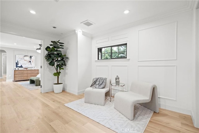 1935 S 6th Ave, Arcadia, CA 91006 - living area featuring arched walkways, light wood-style floors, crown molding, recessed lighting, and a decorative wall