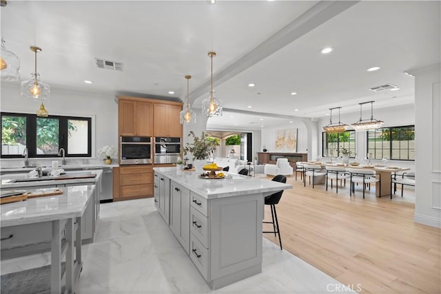 1935 S 6th Ave, Arcadia, CA 91006 - kitchen with a large island, recessed lighting, a kitchen bar, light stone counters, and hanging light fixtures