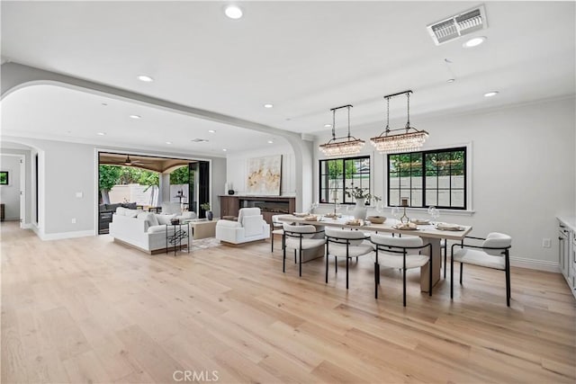 1935 S 6th Ave, Arcadia, CA 91006 - dining space with arched walkways, healthy amount of natural light, light wood-style floors, and recessed lighting