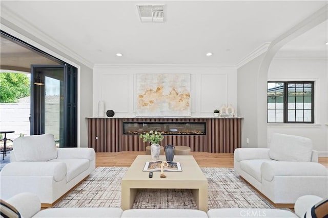 1935 S 6th Ave, Arcadia, CA 91006 - living area with a glass covered fireplace, ornamental molding, arched walkways, wood finished floors, and recessed lighting