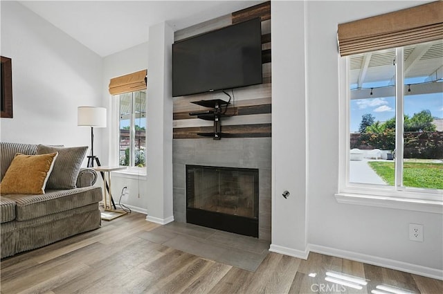 28591 Corvus Way, Menifee, CA 92586 - living room featuring wood finished floors and a fireplace