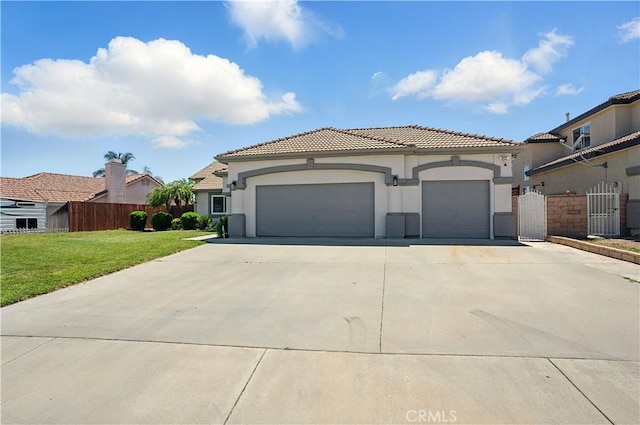 28591 Corvus Way, Menifee, CA 92586 - mediterranean / spanish home featuring a garage, driveway, stucco siding, and a tiled roof