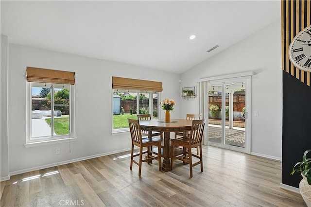 28591 Corvus Way, Menifee, CA 92586 - dining area featuring healthy amount of natural light, vaulted ceiling, light wood finished floors, and recessed lighting