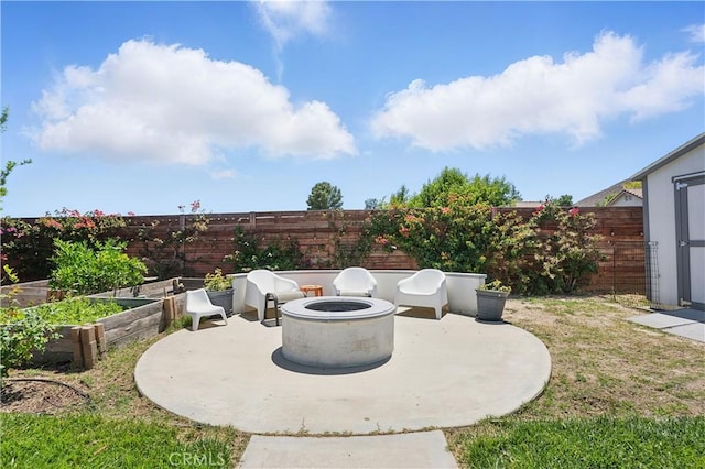 28591 Corvus Way, Menifee, CA 92586 - fenced backyard with a patio, a fire pit, a vegetable garden, and a shed