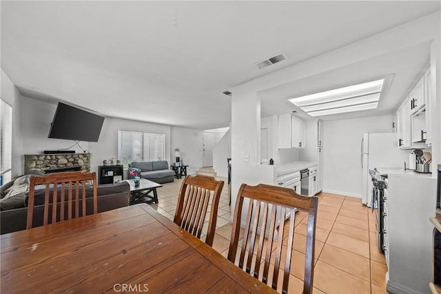 430 Anderwood Ct Unit 24, Pomona, CA 91768 - dining space featuring light tile patterned floors and a fireplace