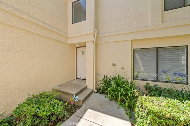 430 Anderwood Ct Unit 24, Pomona, CA 91768 - view of exterior entry with stucco siding
