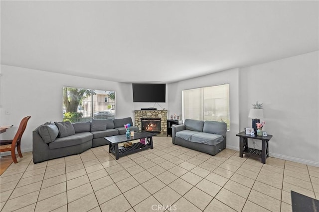 430 Anderwood Ct Unit 24, Pomona, CA 91768 - living room featuring a fireplace and light tile patterned flooring