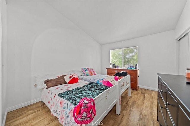 430 Anderwood Ct Unit 24, Pomona, CA 91768 - bedroom with vaulted ceiling and light wood-style floors