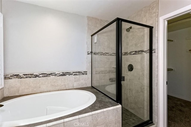 12745 Autumn Leaves Ave, Victorville, CA 92395 - bathroom featuring a bath, a stall shower, and a spacious closet