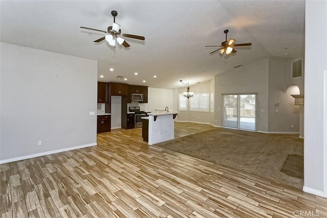 12745 Autumn Leaves Ave, Victorville, CA 92395 - kitchen with open floor plan, a ceiling fan, stainless steel appliances, vaulted ceiling, and recessed lighting