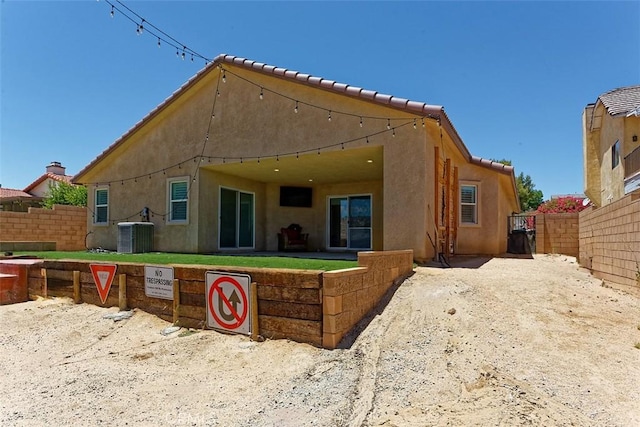12745 Autumn Leaves Ave, Victorville, CA 92395 - back of property with a fenced backyard and stucco siding