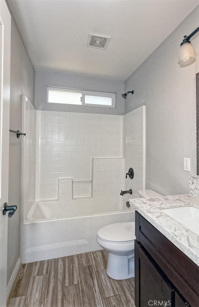 12745 Autumn Leaves Ave, Victorville, CA 92395 - bathroom with vanity, washtub / shower combination, and wood finished floors