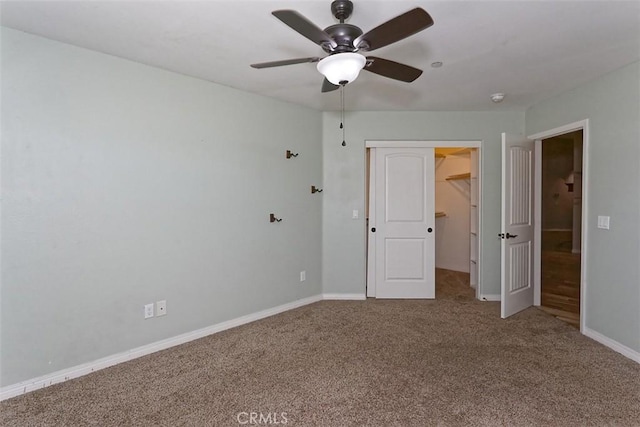 12745 Autumn Leaves Ave, Victorville, CA 92395 - unfurnished bedroom featuring carpet, a walk in closet, a closet, and a ceiling fan