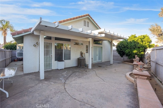 25683 Hillman Ct, Menifee, CA 92586 - back of house featuring stucco siding, a patio area, and a fenced backyard