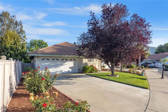 25683 Hillman Ct, Menifee, CA 92586 - view of front of property with stucco siding, an attached garage, a tiled roof, and concrete driveway