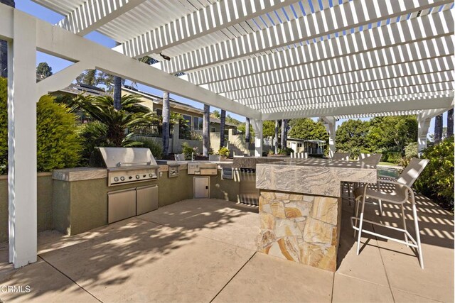 590 Alosta Dr, Camarillo, CA 93010 - view of patio / terrace with a pergola, exterior kitchen, and an outdoor bar