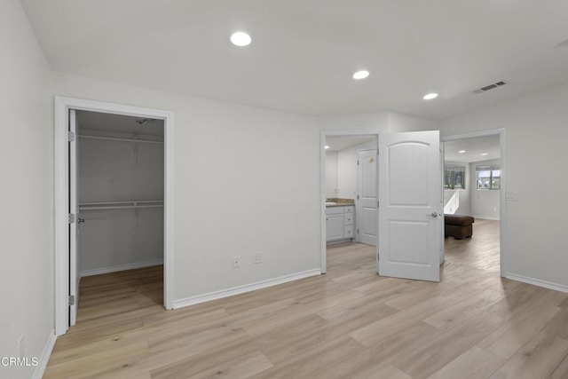 590 Alosta Dr, Camarillo, CA 93010 - unfurnished bedroom with recessed lighting, light wood-style floors, a walk in closet, and a closet