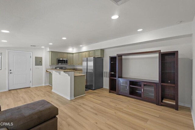 590 Alosta Dr, Camarillo, CA 93010 - kitchen with stainless steel appliances, light wood-style floors, electric panel, a kitchen breakfast bar, and recessed lighting