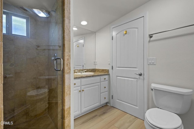 590 Alosta Dr, Camarillo, CA 93010 - bathroom featuring wood finished floors, a shower stall, vanity, and recessed lighting
