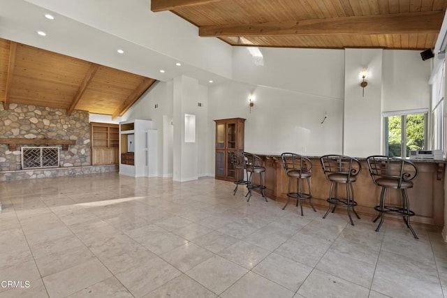 590 Alosta Dr, Camarillo, CA 93010 - kitchen featuring a wood ceiling with exposed beams, recessed lighting, a breakfast bar area, open floor plan, and high vaulted ceiling
