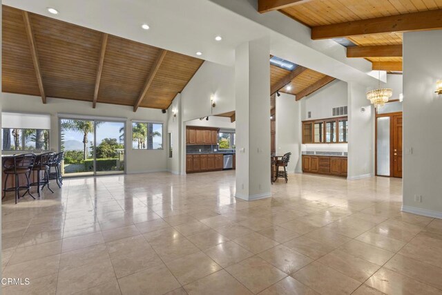 590 Alosta Dr, Camarillo, CA 93010 - unfurnished living room featuring a wooden ceiling with exposed beams, high vaulted ceiling, a chandelier, light tile patterned floors, and recessed lighting