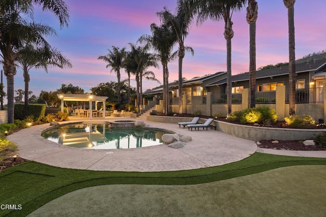 590 Alosta Dr, Camarillo, CA 93010 - pool at dusk featuring a patio area and a pool with connected hot tub
