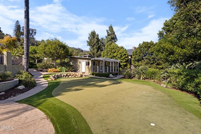 590 Alosta Dr, Camarillo, CA 93010 - view of home's community with a putting green and view of wooded area