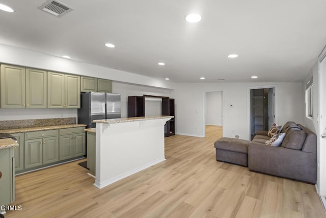 590 Alosta Dr, Camarillo, CA 93010 - kitchen with freestanding refrigerator, green cabinetry, open floor plan, light wood-style flooring, and recessed lighting