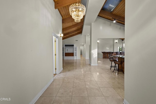 590 Alosta Dr, Camarillo, CA 93010 - hall featuring a wooden ceiling with exposed beams, a chandelier, high vaulted ceiling, and light tile patterned flooring
