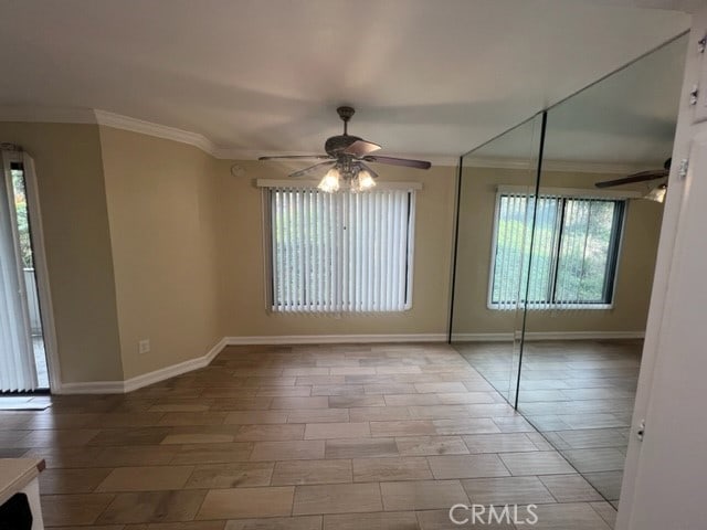 24321 El Pilar Unit 11, Laguna Niguel, CA 92677 - spare room with ceiling fan, ornamental molding, and wood finished floors