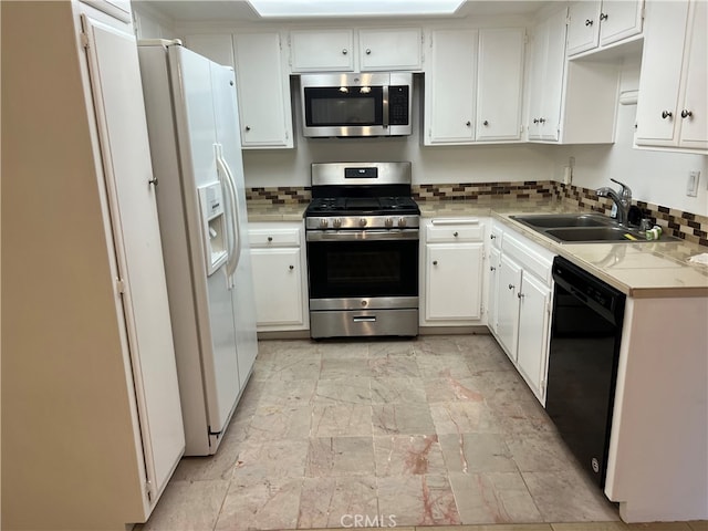 24321 El Pilar Unit 11, Laguna Niguel, CA 92677 - kitchen with appliances with stainless steel finishes, decorative backsplash, light countertops, and white cabinetry