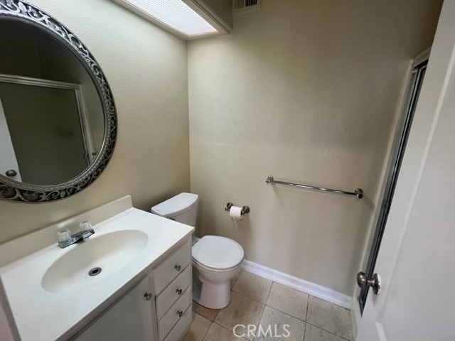 24321 El Pilar Unit 11, Laguna Niguel, CA 92677 - bathroom featuring vanity, tile patterned flooring, and a shower with door
