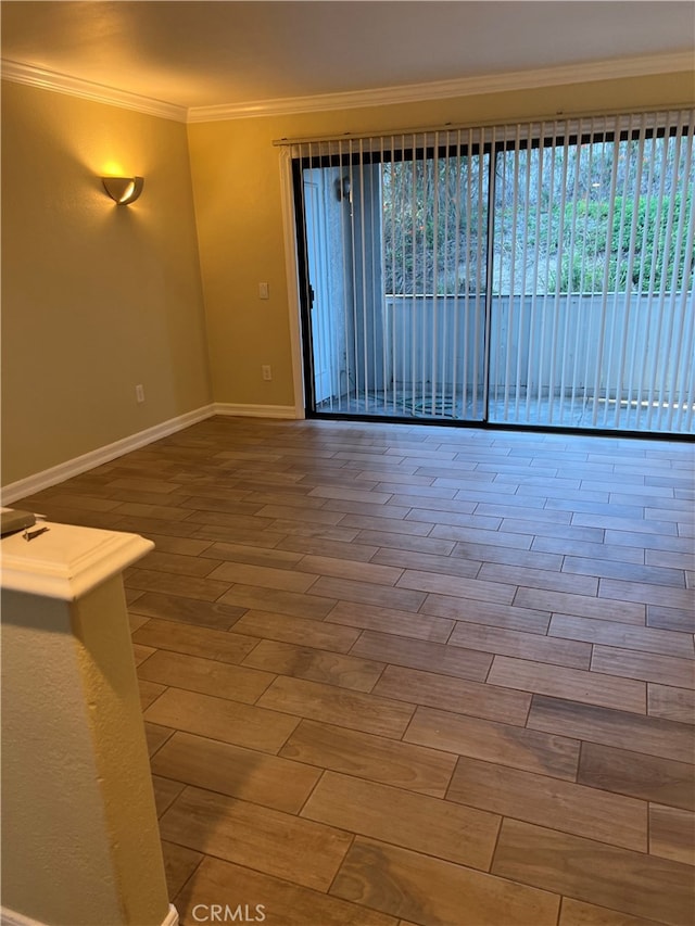 24321 El Pilar Unit 11, Laguna Niguel, CA 92677 - spare room featuring ornamental molding and wood finished floors
