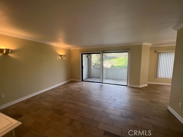 24321 El Pilar Unit 11, Laguna Niguel, CA 92677 - empty room with ornamental molding and baseboards