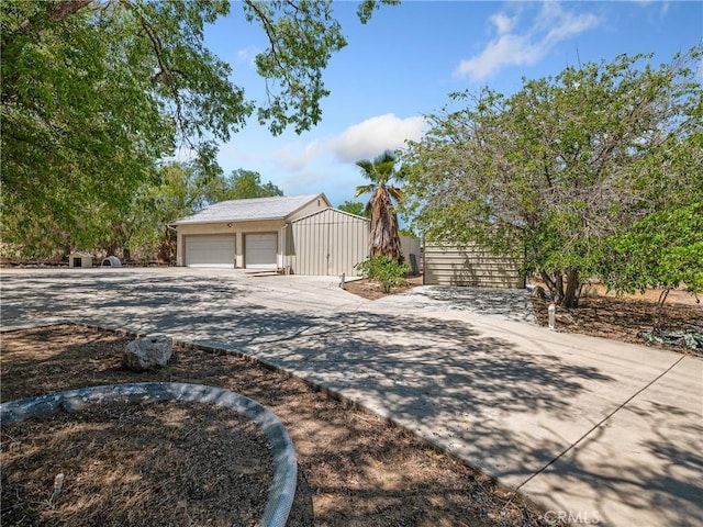31709 213th St E, Llano, CA 93544 - view of front of house with an outbuilding, a garage, and driveway
