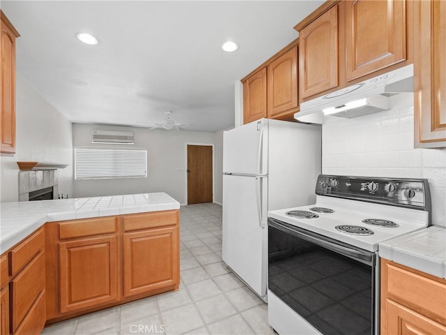 31709 213th St E, Llano, CA 93544 - kitchen featuring white appliances, under cabinet range hood, a wall mounted AC, tile countertops, and a ceiling fan