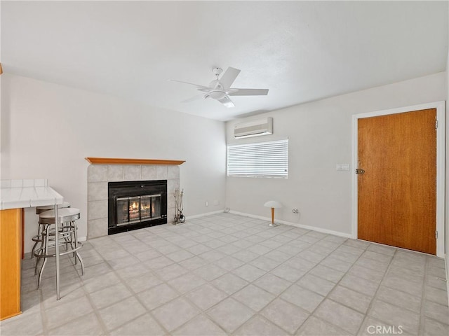 31709 213th St E, Llano, CA 93544 - living area with an AC wall unit, a tile fireplace, and ceiling fan