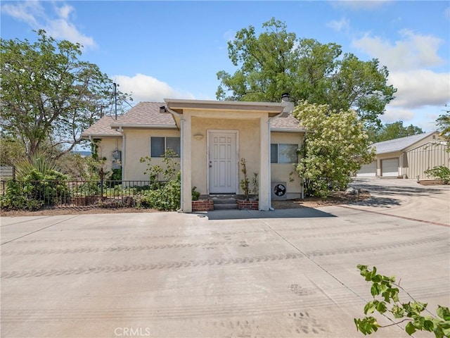 31709 213th St E, Llano, CA 93544 - view of front of house featuring stucco siding and a chimney