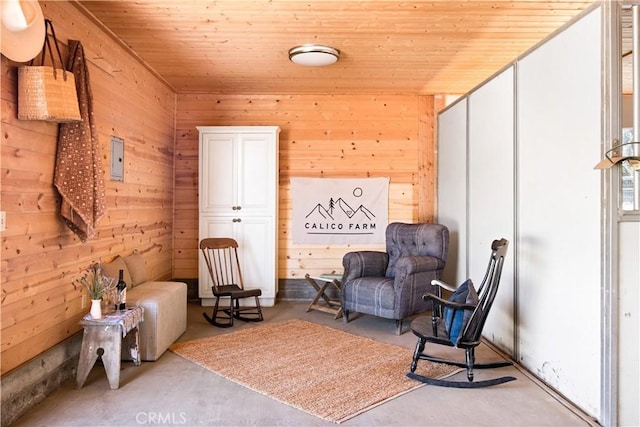 2000 Baldwin Lake Rd, Big Bear City, CA 92314 - living area with wooden walls, wooden ceiling, and concrete flooring