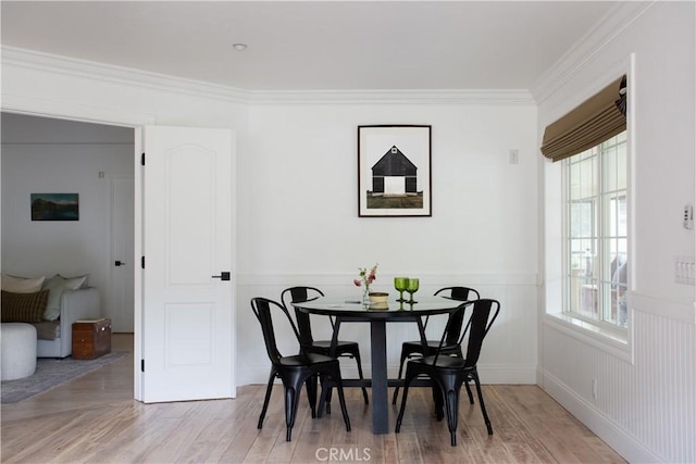 2000 Baldwin Lake Rd, Big Bear City, CA 92314 - dining space with a wainscoted wall, ornamental molding, and light wood-type flooring