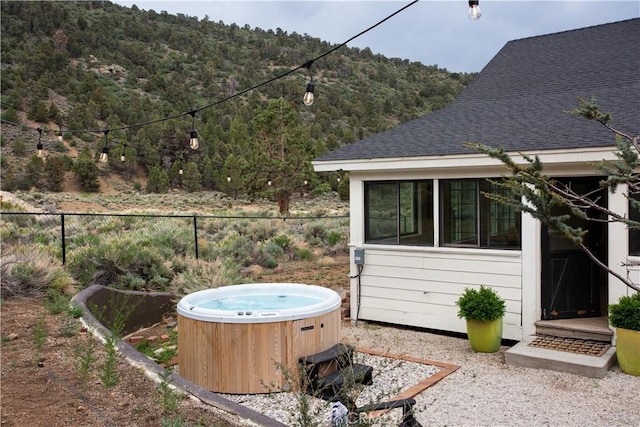 2000 Baldwin Lake Rd, Big Bear City, CA 92314 - view of yard featuring a hot tub and a view of trees
