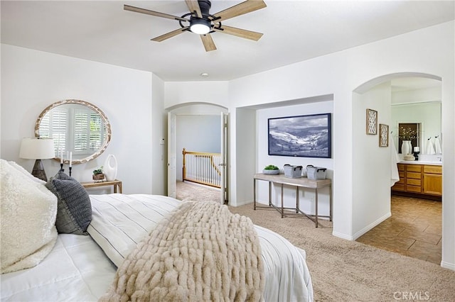 42355 Mountain View Ct, Murrieta, CA 92562 - bedroom with arched walkways, light carpet, and a ceiling fan