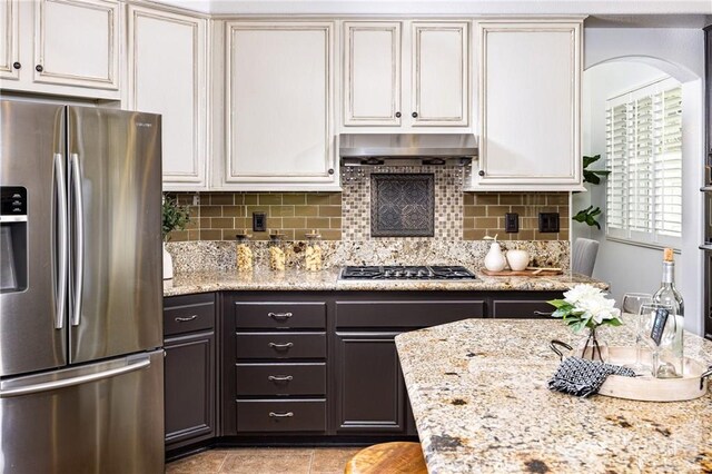 42355 Mountain View Ct, Murrieta, CA 92562 - kitchen with stainless steel appliances, decorative backsplash, light stone counters, and white cabinetry