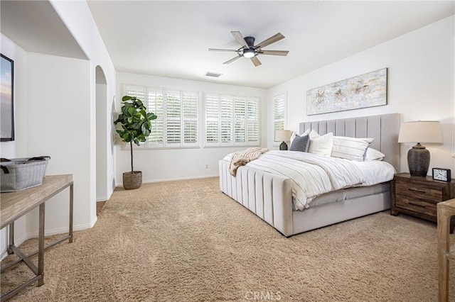 42355 Mountain View Ct, Murrieta, CA 92562 - carpeted bedroom with arched walkways and a ceiling fan