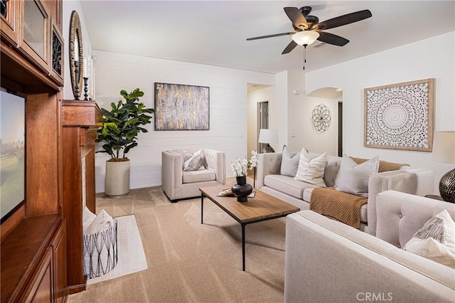 42355 Mountain View Ct, Murrieta, CA 92562 - living room with light colored carpet, ceiling fan, and arched walkways