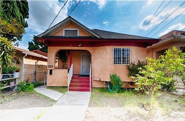 156 S Clarence St, Los Angeles, CA 90033 - view of front of property with stucco siding, covered porch, and a gate