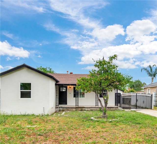 3067 Genevieve St, San Bernardino, CA 92405 - single story home featuring a gate, a porch, and stucco siding