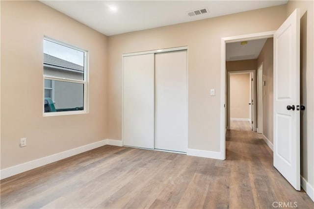 3067 Genevieve St, San Bernardino, CA 92405 - unfurnished bedroom with wood finished floors and a closet