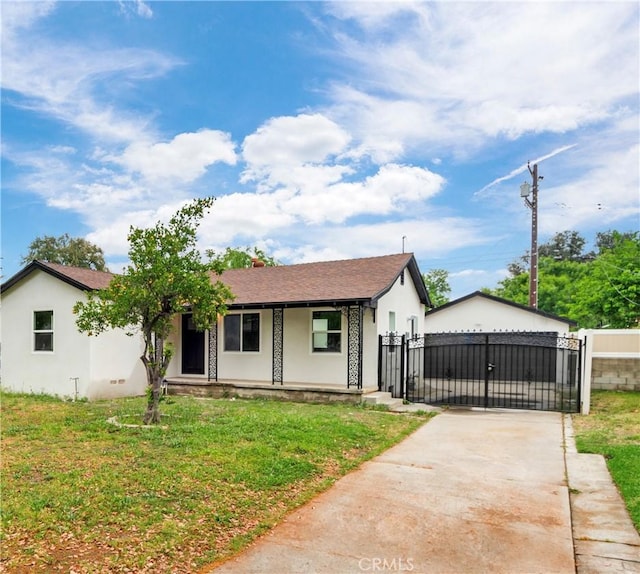 3067 Genevieve St, San Bernardino, CA 92405 - view of front of house with a gate, covered porch, driveway, and stucco siding