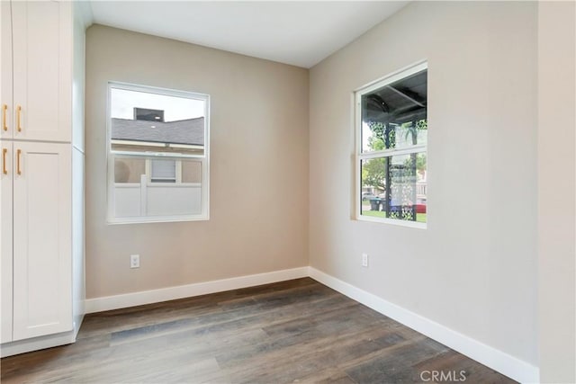 3067 Genevieve St, San Bernardino, CA 92405 - empty room with dark wood-style floors and baseboards